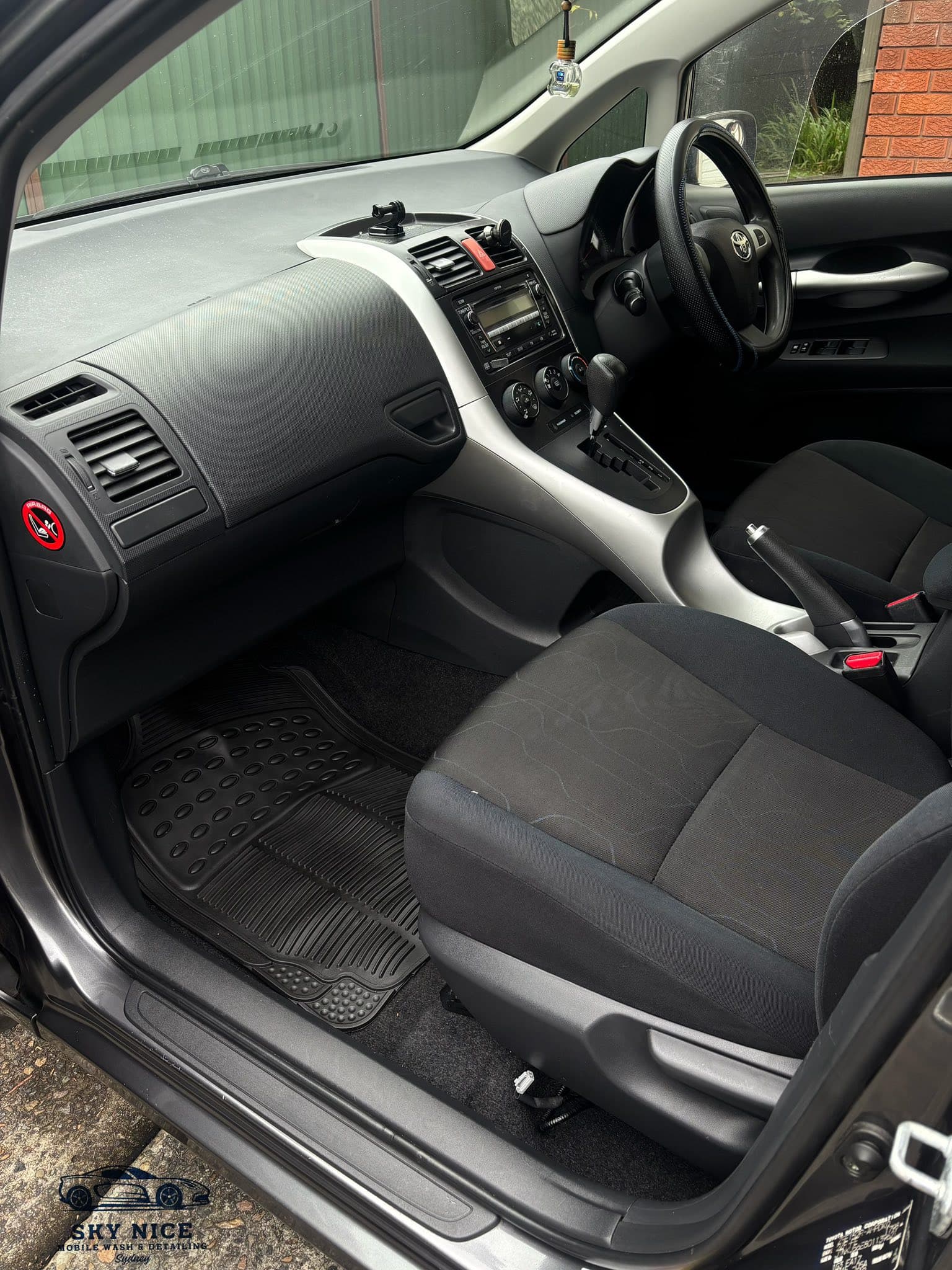 Red car interior before cleaning service